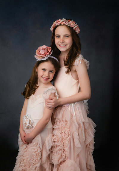 sisters-in-pink-dollcake-dress-standing-in-studio-pose