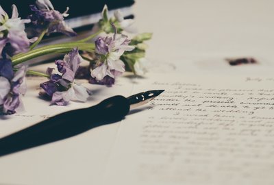 Purple flowers and writing sample.