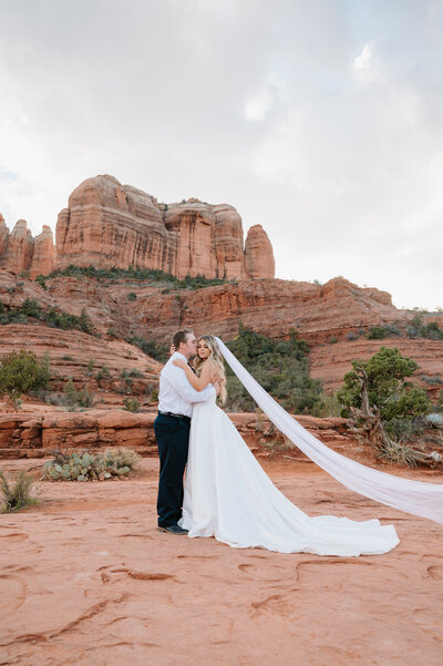Couple posing at Cathedral Rock for wedding photo