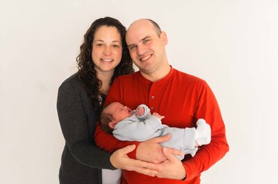 dad holding newborn son