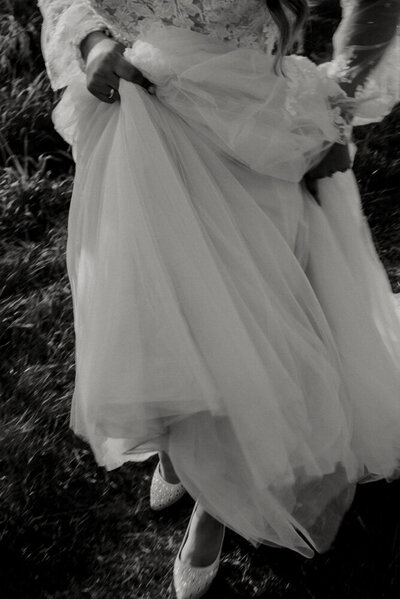 bride running in her wedding dress at pitt lake