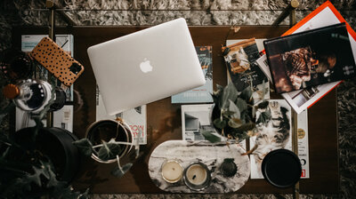 Overhead view of Clair Schwem studio desk while working on a luxury branding project.