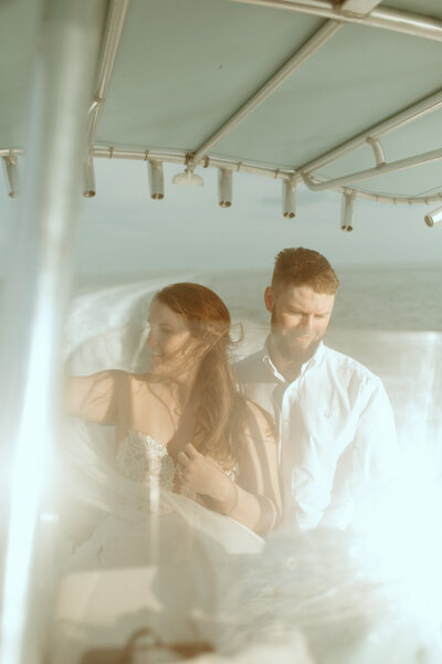 bride and groom on a boat in key west