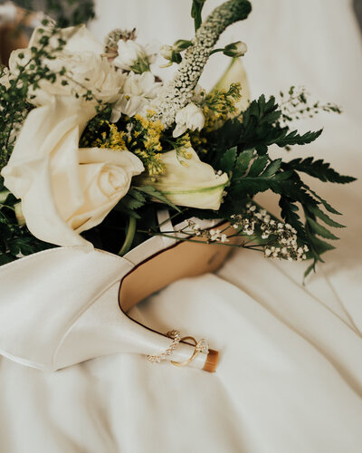 Maddie Rae Photography detail picture of the brides flowers, rings, and shoes
