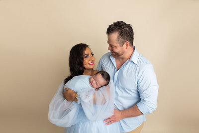 family in blue at newborn session by Philadelphia Newborn Photographer