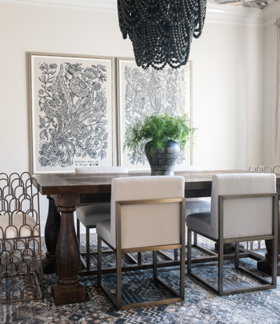 a dining room with a black, white, and neutral color scheme