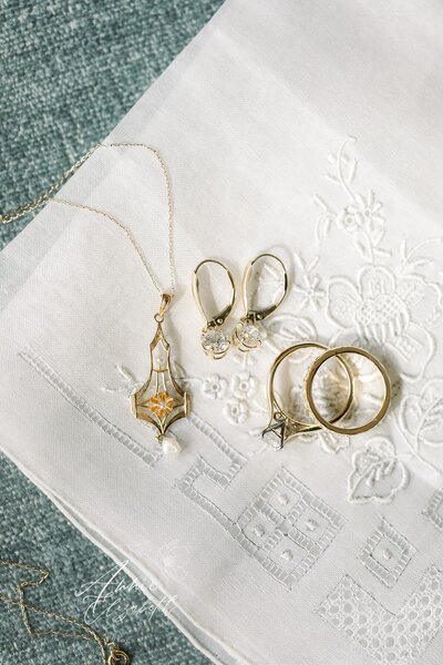 Photo of wedding jewelry on top of a hankerchief