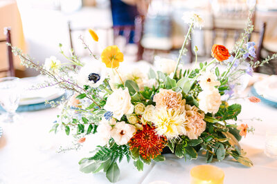 Brightly colored floral centerpiece at wedding reception