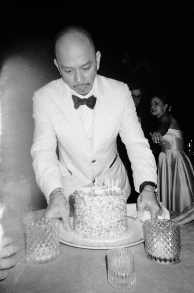 Server in white tuxedo presenting champagne during a classic Beverly Hills Hotel wedding.