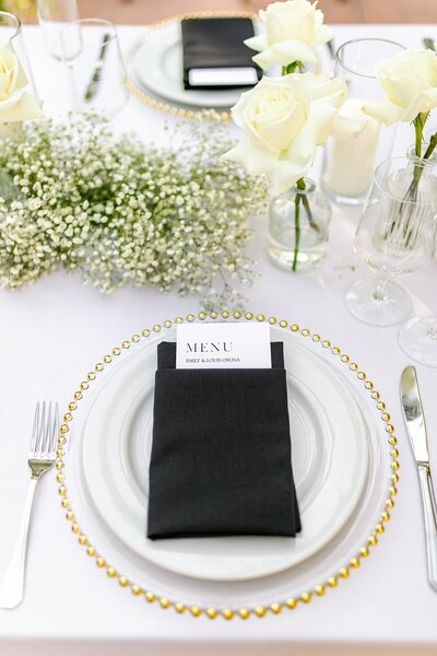 Black and gold place settings at Franciscan Gardens in San Clemente, California.