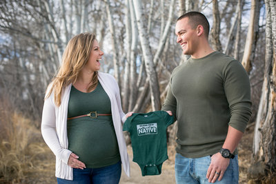Pregnant wife and husband having fun at a photoshoot