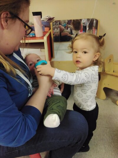 Staff Feeding Infant CPC Albuquerque Childcare