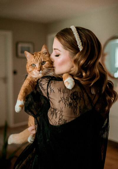 local Iceland Wedding photographer with her cat in their home in Reykjavik
