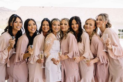 Bridal Party Posingn with Champagne Glasses - Mikayla & Mario | Harmony Meadows Wedding - Lake Chelan Wedding
