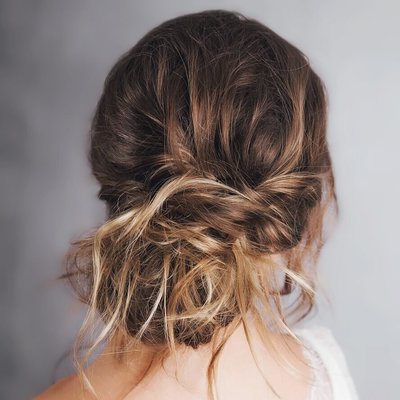 modern messy look hair style for brides