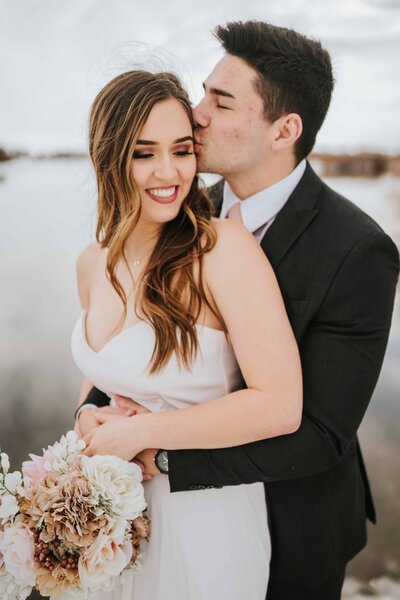 Sacramento Wedding Photographers capture groom kissing bride's forehead