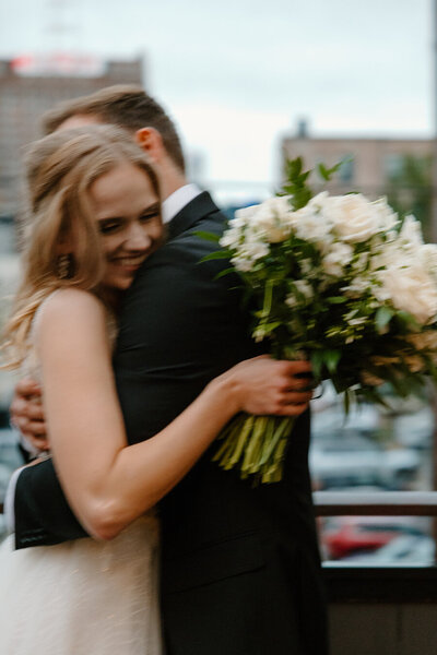bride and groom embracing closely