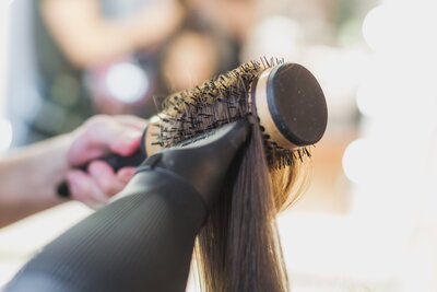 blowdrying-hair-on-round-brush