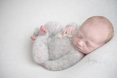 A beautiful framed portrait of  a newborn baby hangs in a South Bend home.