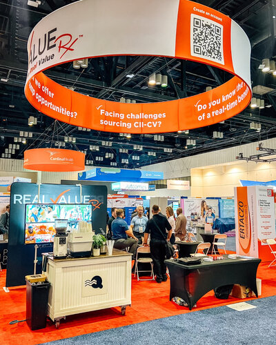Quigley Coffee Co coffee cart serving fresh drinks at a trade show booth, offering branded barista service for conferences and expos.
