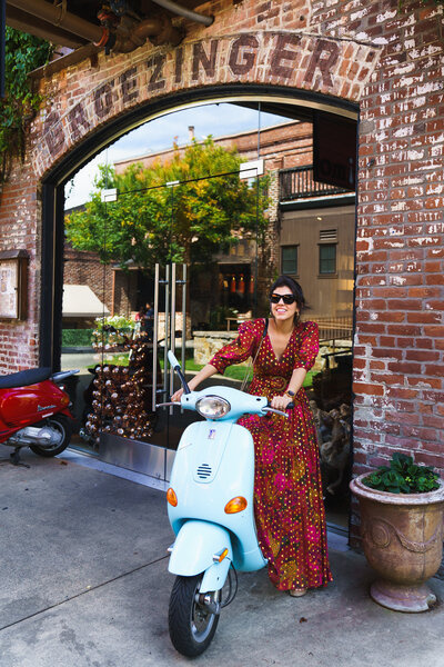 brand photo of a tour guide posing in a vintage bike