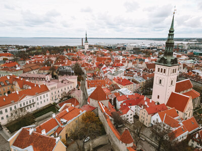 Drone shot of Tallinn, Estonia showing old town red roofs