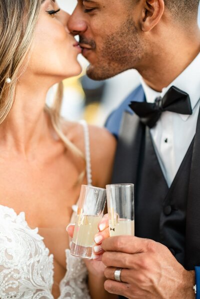 Hotel Valley Ho Wedding Bride and Groom kissing with drinks in hand