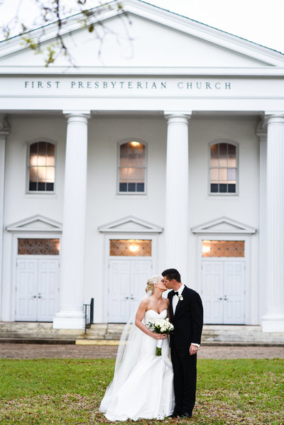 Couple kisses in front of First Presbyterian  Biloxi, Biloxi MS Wedding