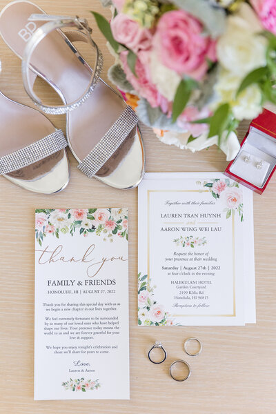 invitation suite styled with shoes  and bouquet