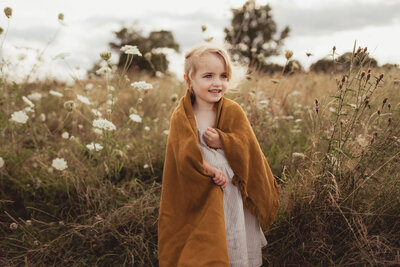 little girl outside nature field