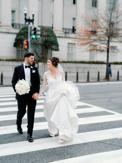 Bride and Groom walk down the street
