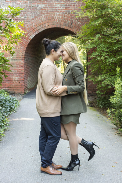 couple kissing after engagement proposal at Biltmore Estate in Asheville, NC