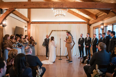 indoor wedding ceremony at barnwood events in madison, winconsin.