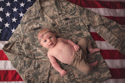 Baby girl with dad's air force  uniform
