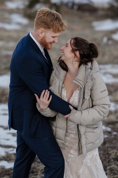 Wedding and Elopement Photography, Bride and groom embrace during sunset mountain micro wedding.