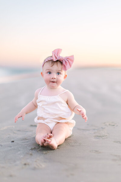 Baby on beach at sunset