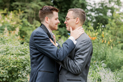 grooms embracing