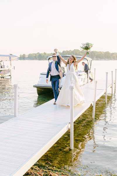Bride and Groom get off a boat to walk into their wedding