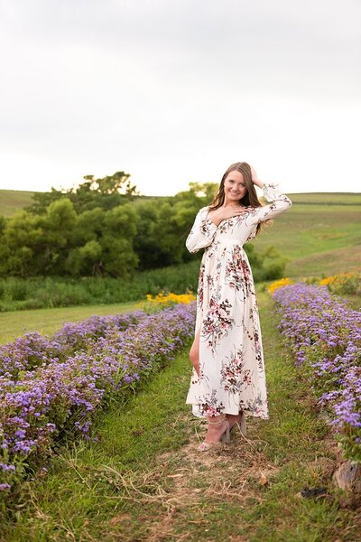 High school senior girl standing in field of flowers at Simmons Farm in Pittsburgh, PA