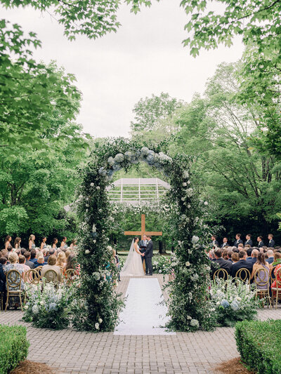 Couple gets married outside in Georgia under luxury floral arch