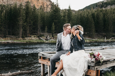 Bride and groom sharing a kiss during their Yellowstone elopement.