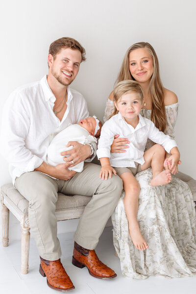 family of four with newborn