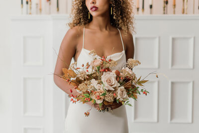 Autumn florals and modern bridal gown by Blush & Raven, a couture wedding bridal boutique based in Calgary, Alberta. Featured on the Brontë Bride Blog.