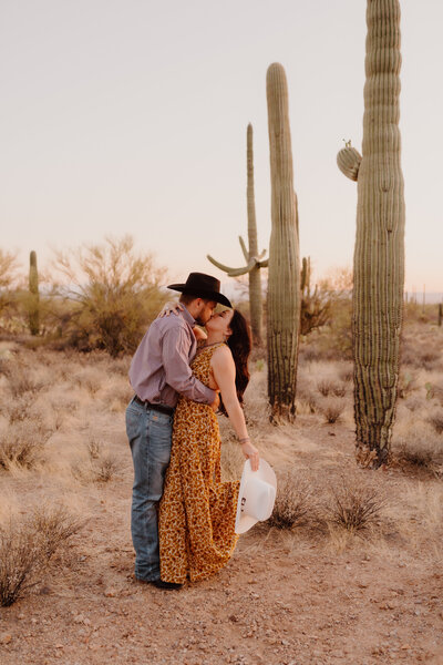 couple kissing in desert