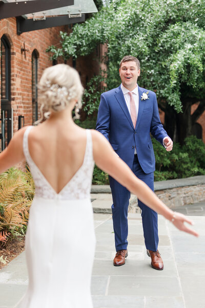 groom's first look reaction to bride at huguenot loft wedding in greenville south carolina