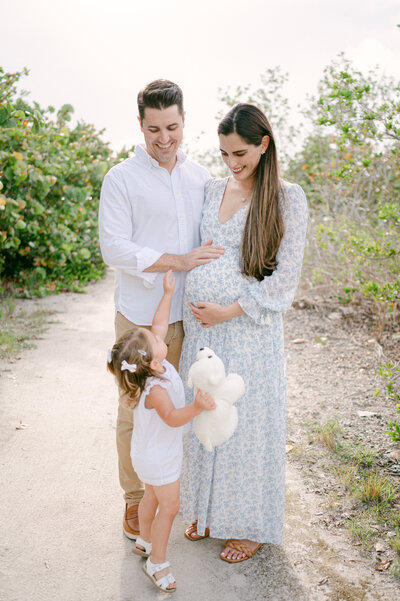 Toddler touching baby bump by Miami Maternity Photographer
