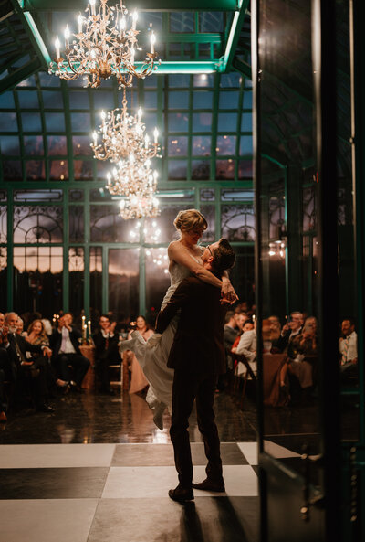 Cinematic first dance captured in the chandelier-lit solarium at The Little Chapel at Haven Ridge, blending editorial style with raw emotion.