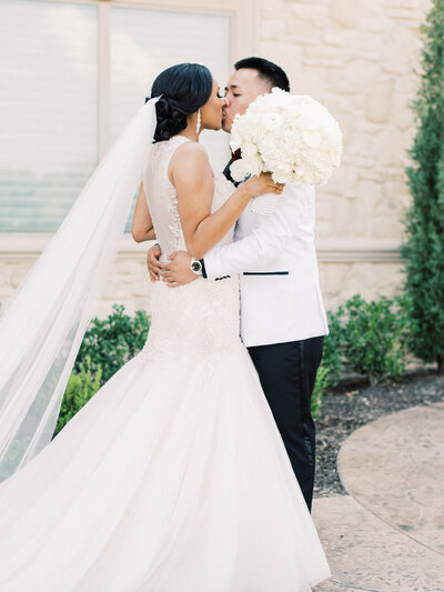 Dallas Bride and Groom embracing and kissing on their wedding day