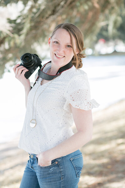 Seattle Wedding Photographer captures woman smiling while holding camera