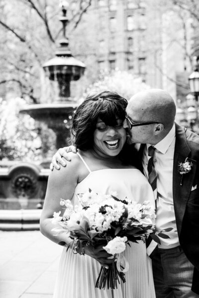 A couple hugs after eloping at  Manhattan City Hall